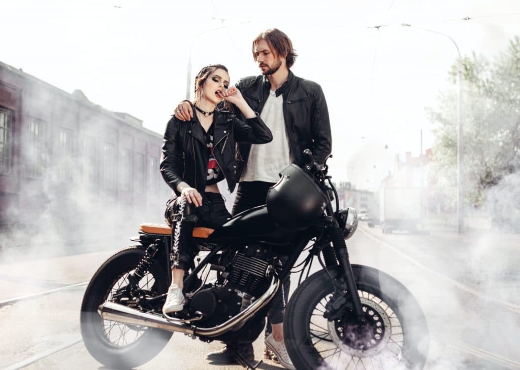 couple in love and vintage custom motorcycle e1632899738492